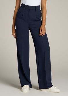 About Our Extra-Long Women’s Dress Pants Make a statement in these stylish pleated women’s tall dress pants. Pleated trousers are a timeless trend you’ll love and now, there’s finally a pair that will accentuate your long legs. These pants for tall women have been designed specifically for ladies between 5’9” and 6’6”, with a full length offering extra-long inseam options. They have a high-rise silhouette that gives the appearance of a cinched waist, complete with a fly zipper and hook and bar c Long Pants Women, Straight Leg High Waist Pants, Pants For Mid Size Women, Formal Pant Designs For Women, Navy Blue Pants Outfit Women Classy, Tailor Trousers Women, Pants Trousers For Ladies, High Rise Dress Pants Outfit, High Waist Trousers Women