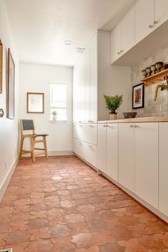 the instagram page shows an image of a kitchen with white cabinets and tile flooring