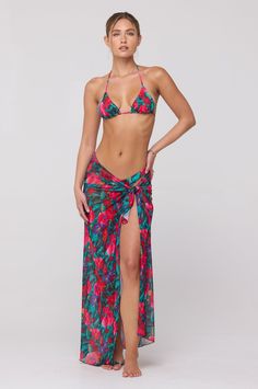 Transform your beach look with our Perfect Scarf Top and Sarong in Resort. This multifunctional piece effortlessly doubles as a chic scarf top and a stylish coverup sarong. From poolside to dinner, this versatile item will elevate your vacation wardrobe with its elegance and luxury. Multifunctional scarf top or sarong Fabric: 95% Polyester, 5% Spandex Machine wash cold on delicate cycle, air dry One size Measurements: 43" by 43" Made in Los Angeles Resort Season Beach Cover-up Swimwear, Beach Season Triangle Top Cover-up, Beach Party Tropical Print Cover-up, Spring Beach Party Sarong With Tie-side, Spring Beach Party Tie-side Sarong, Tropical Tie-side Sarong For Spring, Spring Tropical Tie-side Sarong, Spring Tropical Print Sarong Beachwear, Triangle Top Beachwear Cover-up For Swimming