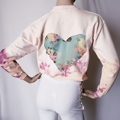 New With Tags. Ivory/ Cream Colored Knit Sweatshirt. Tie Dye Acid Wash In A Purple/Wine Color. Back Features A Green Chiffon Floral Print Heart In The Middle. Very Unique. 50%Cotton 50%Polyester Measurements (Appx.) Armpit To Armpit = 19" Length = 24" Top Of Shoulder To Sleeve = 20" *There Appears To Be A Stain On The Right Upper Side (Updated Pic), Doesn't Seem Too Noticeable. Spring Long Sleeve Tops With Heart Graphic, Pink Long Sleeve Top With Heart Graphic, Spring Long Sleeve Sweatshirt With Heart Graphic, Pink Fitted Sweatshirt For Spring, Fitted Pink Sweatshirt For Spring, Sweatshirt Tie Dye, Brown Crewneck, White Long Sleeve Sweater, Dye Sweatshirt