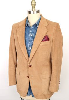 "\"The Townie\" vintage 1980s corduroy jacket by iconic 80s label Jordache in rich, classic tan khaki with brown knot-style buttons, featuring: 2-button front, notch lapel, chest pocket (for pocket square), 3-button cuffs, center vented back, and full lining with interior pockets--Beautiful condition! SIZE: Tagged Size 38 Regular (Men's Small) MEASUREMENTS*: Shoulder: 17\" Chest (underarm to underarm): 19.5\" Waist: 18\" Length (base of collar to back hem): 30\" Sleeve (outside shoulder seam to Brown Single-breasted Corduroy Sport Coat, Brown Corduroy Single-breasted Sport Coat, Brown Corduroy Blazer With Button Closure, Brown Corduroy Single Breasted Blazer, Vintage Brown Cotton Blazer, Brown Corduroy Sport Coat For Winter, Brown Corduroy Sport Coat For Fall, Winter Brown Corduroy Sport Coat, Casual Brown Corduroy Sport Coat