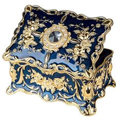 a blue and gold box with an ornate design