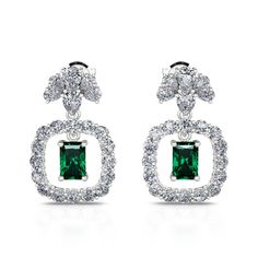 This classic earrings are timeless, bringing an opulent finish to casual and evening ensembles. Expertly crafted in sterling silver, each earring showcases a very fine radiant cut stone, surrounded by a single row of round brilliant white stones. A magnificent combination of radiant, teardrop and round cut stones all set in a gleaming silver design. Sweep hair into a low chignon to display the design in full.Carat Weight: 3 ctStone Size: 5*7 mmStone Type: Jeulia® StoneNumber of Stones: 2 Stone S Classic White Gold Emerald Diamond Earrings, Formal Emerald Earrings With Prong Setting, Formal Baguette Cut Emerald Earrings, Formal Baguette-cut Emerald Earrings, Classic White Gold Baguette-cut Earrings, Classic White Gold Baguette Cut Earrings, Elegant Emerald Diamond Earrings In White Gold, Classic Emerald Earrings For Formal Occasions, Elegant Silver Rectangular Diamond Earrings