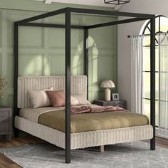 a bedroom with green walls and a four poster bed in the middle, along with two nightstands