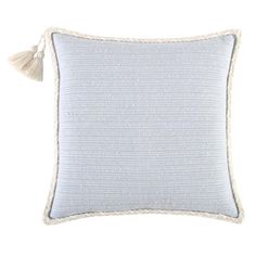 a light blue and white pillow with tasselled edges