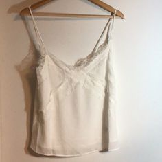 Top Is Nwot And In Good Condition White V-neck Tank Top With Delicate Straps, White V-neck Camisole With Delicate Straps, Feminine White Camisole With Lace Top, Elegant White Tank Top With Straps, Feminine White Lace Top Camisole, Elegant White Top With Tank Straps, Feminine White Lace Camisole, White Tank Camisole With Delicate Straps, White V-neck Tank Top For Brunch