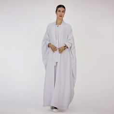 Feature： High-Quality Material, soft and comfortable Can be worn all year round. 2 Pieces set, With Outer Abaya And Sleeveless Inner Dress Excellent gift ideas. Specifications： Material: Heavy Wrinkle Gender: Female Age group: Adult Size: S-2XL Size Guide： Shipping: Now, we provide free shipping to United States, United Kingdom, Canada, Saudi Arabia, Australia, China, Denmark, Finland, Poland, Romania, India, Japan, Turkey, United Arab Emirates, Israel, Bulgaria, Hungary, Indonesia, Tajikistan, Casual Solid Color Abaya For Spring, Casual Solid Abaya For Spring, Casual Abaya For Spring, Spring Daywear Abaya, Intellectual Style, Long Skirt Fashion, Irregular Patterns, Muslim Outfits, Abaya Dress