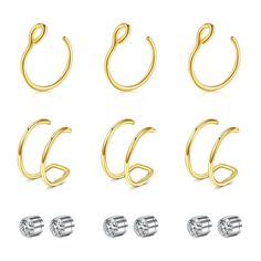 six pairs of gold and silver hoop earrings with cz stones on each earring