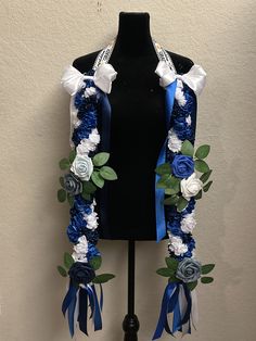 a black mannequin with blue and white flowers on it