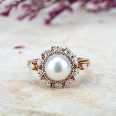 Pearl Blossom Ring - Ethereal Akoya Pearl & Moissanite Petals Ring hahalo rings flora rings for women gift Luxury Pearl Wedding Ring With Gemstone, Exquisite Yellow Gold Pearl Ring For Wedding, Luxury Wedding Pearl Ring With Gemstone, Luxury Pearl Gemstone Ring For Wedding, Luxury Pearl Wedding Ring, Elegant Pear-shaped Pearl Ring For Anniversary, Elegant Pear Shaped Pearl Ring For Anniversary, Elegant Gold Pearl Ring With Rose Cut Diamonds, Yellow Gold Brilliant Cut Pearl Ring For Wedding