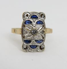 Estate wonderful art deco 18k yellow gold with platinum top sapphire diamond ring. sz 8.25. 3 grams. 16.49mm long. unmarked acid tests for 18k.great condition. estate 1920's ring. will come in great ring box. beautiufl estate piece. 3 small diamond and 6 sapphires. Yellow Gold Multi-stone Art Deco Jewelry, Art Deco Multi-stone Yellow Gold Jewelry, Art Deco Yellow Gold Multi-stone Jewelry, Gold Oval Sapphire Ring In Art Deco Style, Collectible Yellow Gold Rings With Diamond Accents, Gold Art Deco Ring With Center Stone, Art Deco Gold Sapphire Ring In 14k Gold, Gold Art Deco Sapphire Ring In 14k Gold, Art Deco 14k Gold Sapphire Ring