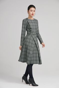 "Retro wool plaid long sleeves dress in classic hues of gray, black and white. This dress features a round neckline,fitted waist, fully lined and a back zipper closure. Details: * plaid wool fabric with fully polyester lining * long sleeves * round neckline * back zipper closure * no pockets * knee length * with buttons decoration * womens dresses, winter dress SIZE GUIDE Size vary between Brand and Country Please get your body measurement with our Size Guide And Find your size in our Size Chart Winter A-line Midi Dress For Office, Winter Wool Tweed Dress Knee-length, Wool Long Sleeve Dresses For Work, Winter Wool Tweed Knee-length Dress, Knee-length Wool Tweed Dress For Winter, Plaid Midi Dress For Work, Fitted Plaid Winter Dress, Fall Tweed A-line Dress For Work, Knee-length Wool Tweed Dress For Fall