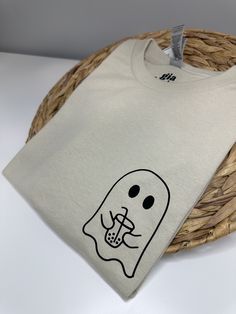 The perfect spooky boba Ghostie shirt.  Sweatshirt Material:  - 50% Cotton and 50% polyester -Incredible soft and very comfortable Machine wash in cold water- shirt inside out Do not use bleach Tumble dry low Iron on low heat with shirt inside out Never iron directly over design Thank you for supporting my small mama business. Halloween Graphic Print Top As Gift, Casual T-shirt With Character Print As Gift, Themed Crew Neck T-shirt As Gift, Themed Crew Neck T-shirt For Gift, Themed Cotton T-shirt As Gift, Themed Cotton T-shirt For Gifts, Themed Cotton T-shirt For Gift, Casual Halloween T-shirt For Gift, Casual Tops With Character Print For Gifts