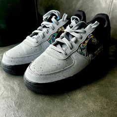 Enhance Your Kid's Sneaker Collection With These Stylish Nike Air Force 1 Low Lv8 Gs Sneakers. Designed With Synthetic Leather Upper Material And Rubber Outsole Material, These Lace-Up Sneakers Offer A Standard Shoe Width And Are Perfect For Athletic Activities. The Grey Colorway Features Graffiti Graphics That Make These Shoes Stand Out From The Rest. These Nwot Sneakers Are In Great Shape And Were Manufactured In 2020 In Vietnam. The Nike Brand Is Well-Known For Its Quality And Durability, Mak Gray Basketball Shoes With Air Max Cushioning, Custom Sports Sneakers With Speckled Midsole, Gray Custom Sneakers For Streetwear, Custom Lace-up Sneakers With Speckled Midsole For Sports, Gray Air Max Cushioned Basketball Shoes For Streetwear, Gray Basketball Shoes With Air Max Cushioning For Streetwear, Gray Custom Sneakers With Speckled Midsole For Sports, Custom Gray Sneakers With Speckled Midsole For Sports, Gray High-top Custom Sneakers For Sports