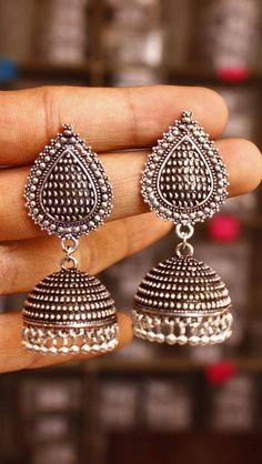 Listed as a must-have earring, jhumkis will always be a woman's favorite accessory! Our  Leaf Silver Oxidised Jhumkis are one to would opt for when you want the simple yet trendy look, pair these up with your straight kurtas or your soft mulmul sarees, these will leave you feeling pretty all day long! Silver Dual-tone Earrings For Navratri, Traditional Oxidized Drop Earrings Jhumkas, Silver Dual-tone Bohemian Jhumkas, Traditional Silver Earrings With Tilla, Bohemian Silver Dual-tone Jhumkas, Traditional Oxidized Jhumkas Drop Earrings, Traditional Silver Tilla Earrings, Traditional Oxidized Finish Jhumkas Drop Earrings, Silver Bohemian Dual-tone Jhumkas