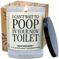 a candle that is sitting in front of a box with the words i can't wait to poop in your new toilet