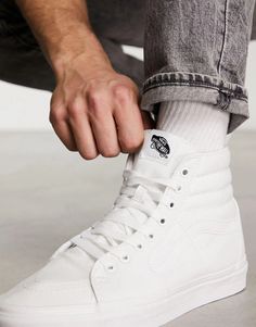 Stay authentic on the 'gram in the timeless Vans SK8-Hi. Iconic high-top hi-visibility white leather upper pairs practical cushioned comfort with on-trend vintage skate style, featuring lace-up closure, padded ankle support and grippy waffle sole to let your natural flair shine through on and off camera. Pro-level shoe legends since '66, upgraded with podiatrist-approved arch support and heel cupping for influencer-approved all-day wear that stays true to your coastal cool aesthetic. Vans Mid-top Skate Shoes, Vans Mid-top Skate Shoes For Sports, Urban High-top Sneakers With Rubber Toe Cap, Urban High-top Sneakers With Rubber Toe Cap For Sports, Vans High-top Sneakers With Rubber Toe Cap, Summit White Sneakers For Streetwear With Round Toe, Functional Sneakers With Rubber Toe Cap For Streetwear, Functional High-top Sneakers With Rubber Toe Cap, Summit White Sneakers For Streetwear