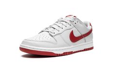 The Nike Dunk Low “Vast Grey/Varsity Red” is a classic colorway of the vintage basketball and lifestyle shoe with a white-and-red color scheme.  The Dunk returned in a big way back in 2020 before becoming a core component of Nike’s seasonal footwear releases thereafter.  Here, the “Vast Grey/Varsity Red” features a white leather upper with tonal leather overlays.  A contrasting Varsity Red leather Swoosh is found on either side of the shoe.  The red hue also appears on the heel tab with “Nike” e Dunk Low Vast Grey, Dunks Outfit, Low Dunks, Vintage Basketball, Red Color Schemes, Red Nike, Nike Red, Stadium Goods, Nike Dunk Low