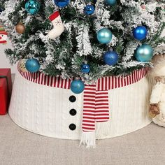 a decorated christmas tree in a white basket