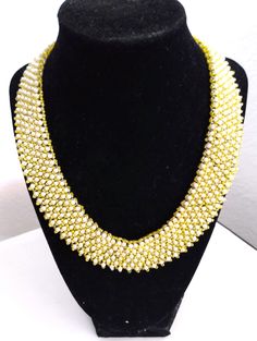 A handmade glass beaded necklace that is perfect for any occasion: parties, holidays, birthdays, anniversaries. All products are hand-crafted by my mother. Dimensions: - Actual Length: 21.5 cm - Collar Length: 20.6 cm - Width: 17.4 cm - Height: 3.0 mm Lightweight, high quality with a beaded hook as a clasp.  Acrylic Pearls: 8 mm. Will respond to concerns and suggestions promptly. Shipping costs: Free Domestic Shipping. All orders are sent by air-mail with tracking number. Time of delivery: Estimated 1-3 days for domestic shipping; international make take 7-14 days. Feel free to check out our other similar products! https://noorsjewelers.etsy.com Gold Crystal Necklaces With Round Beads For Party, Party Gold Crystal Necklaces With Colorful Beads, Party Pearl Beaded Necklaces With Gold Beads, Party Crystal Necklaces With Spacer And Round Beads, Party Crystal Necklaces With Spacer Beads, Party Pearl Beaded Necklace With Gold Beads, Party Crystal Necklaces With Round Spacer Beads, Party Pearl Necklace With Gold Round Beads, Glass Beaded Necklaces For Party