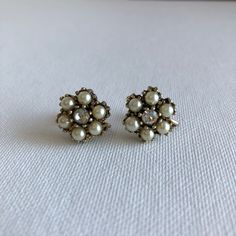 Gorgeous earrings in great condition! Lovely for a vintage wedding for bride or bridesmaid! Great condition (see condition description). They have a screw on clip on back to them. Width - 1.2cm Length - 1.2cm Era - 50s Tag - none Material - metal, plastic pearls, glass stones Condition - Great, except for two pearls having a very small mark on them, hardly noticeable. Victorian Screw Back Earrings For Wedding, Victorian Screw Back Wedding Earrings, Victorian Wedding Earrings With Screw Back, Antique Clip-on Pearl Earrings For Wedding, Vintage Clip-on Earrings For Wedding, Vintage Silver Earrings For Wedding, Classic Clip-on Bridal Earrings For Parties, Vintage Silver Bridal Earrings For Evening, Vintage Silver Wedding Earrings