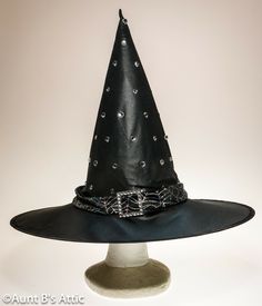 Dressy jeweled witch hat, is in a black poly, that has almost a satin shine to it. Trimmed with a silver spider web design band, and accented with a rhinestone buckle. Includes an extra pack of jewels. 5" wired brim, 14 1/2" crown. Very pretty! Halloween Costume Hats, Spider Web Design, Costume Hats, Witch Hat, Halloween Art, Spider Web, Halloween Costume, Witch, Web Design