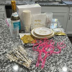 the table is covered with confetti, candy sticks, and other items that have been placed on it