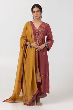 Maroon kurta with thread and sequin embroidery in leaf motif. Paired with matching embroidered hem pant and mustard yellow dupatta. - Aza Fashions Festive V-neck Salwar Kameez With Zari Work, Diwali V-neck Sharara With Resham Embroidery, Bollywood Style Embroidered V-neck Set, Festive V-neck Sets With Resham Embroidery, Diwali Palazzo Set With Zari Work And V-neck, Embroidered V-neck Salwar Kameez For Festive Occasions, Festive V-neck Anarkali Set With Chikankari Embroidery, Traditional Embroidered V-neck Palazzo Set, Bollywood Style V-neck Sets With Mirror Work