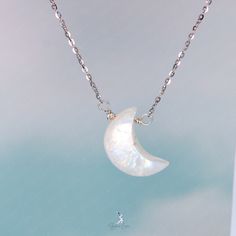 This elegant crescent moon pendant necklace features a crescent moon shape moonstone with blue flash, on solid 925 sterling silver cable chain and platinum plating. Add this elegant crescent moon moonstone pendant necklace to your everyday fine jewelry collection or as gift for your loved ones. Pendant dimensions: 0.68 x 0.48 inNecklace length: 17.5 in with the adjustable ballMaterials: moonstone, 925 sterling silver Jewelry Care: See more information about how to care for your jewelry here. Shipping Policy: Orders will be shipped within 1-3 business days. Economy shipping will take 7-14 days to arrive and standard shipping is 1- 4 days for U.S. orders. International shipping time is depended on the country and per shipping method. Shipping cost will be calculated at check out.For more det White Sterling Silver Necklace With Moon Charm, Celestial Silver Moon Crystal Necklace, White Moonstone Crystal Necklace With Moon Charm, Moon-shaped Sterling Silver Crystal Necklace, Silver Moon-shaped Sterling Silver Crystal Necklace, Silver Sterling Silver Moon Crystal Necklace, Celestial Sterling Silver Crystal Necklace With Moon Charm, White Moon Charm Necklace, White Moonstone Jewelry With Moon Charm