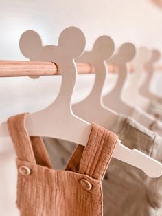 wooden clothes hangers with mickey mouse heads on them