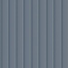 a blue wall with vertical lines on it's sides and the bottom half painted gray