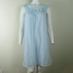 "LOVELY AND FEMININE WITH TONS OF VINTAGE CHARM Vanity Fair Vintage Chiffon Short Nightgown in Light Blue Two layers of nylon Especially Pretty Lace Made in the USA Size: Small 36\" length (shoulder to hem) 38\" bust (19\" seam to seam) Wonderful Vintage Condition item#0225/098897" Sleeveless Blue Nightgown With Lace Trim, Light Blue Sheer Dress For Daywear, Sheer Sleeveless Nightgown For Sleep, Vintage Light Blue Summer Nightgown, Vintage Blue Sheer Sleepwear, Blue Sheer Vintage Sleepwear, Blue Sheer Sleep Dresses, Sheer Blue Sleep Dresses, Vintage Sheer Sleeveless Sleepwear