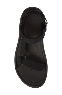 Adjustable hook-and-loop straps mean a custom fit in a water-ready sandal featuring a shock pad and padded heel for additional cushioning. Adjustable straps with hook-and-loop closure Cushioned footbed Textile upper/ textile and synthetic lining and sole Imported Men's Shoes Black Strap Sandals In Synthetic Material, Black Synthetic Strap Sandals, Black Waterproof Synthetic Sport Sandals, Black Waterproof Sport Sandals With Round Toe, Black Sport Sandals With Adjustable Double Straps, Black Adjustable Double Strap Sandals, Double Strap Sport Sandals With Cushioned Footbed, Black Double Strap Slides With Adjustable Strap, Casual Black Sport Sandals With Strap