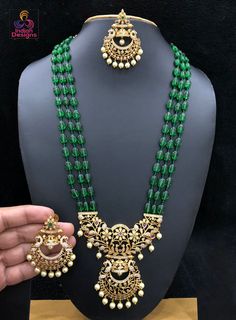 High quality semiprecious color beaded necklace 20 inch length with awesome traditional temple design floral pendant studded with CZ ad stones and emerald ruby stones. The pendant set comes with matching pair of earrings. Rubies Jewelry, Long Bead Necklace, Ruby Jewelry Necklaces, Indian Necklace, Bollywood Jewelry, Long Beaded Necklace, Floral Pendant, Indian Bollywood, Cz Jewelry