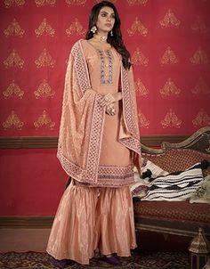 luxury Women Peach colored Salwar Kameez in Sharara Style made with Faux Georgette top and Faux Georgette Bottom fabricProcessing Time : 5-7 Business DaysWork : Heavy Embroidery & Lace WorkFabric:Top : Semi-Stitched SuitsBottom : Faux GeorgetteDupatta : Faux Georgette Sangeet Sharara, Peach Sharara, Sharara Style, Sharara Suits, Georgette Tops, Salwar Kameez Online, Heavy Embroidery, Indian Suits, Statement Dress