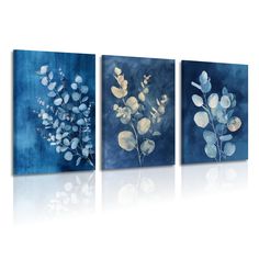 three paintings with blue and white flowers on them