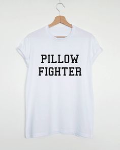 Pillow fighter women's or unisex T-shirt. Please refer to our size chart in the thumbnails for exact dimensions. Customisation: If you want a custom shirt with your text or drawing, please contact us. In case you have any questions, just drop us a line and we will give you 110% of our support. Product information: The sleeves are rolled up for display purposes only. In photos you see Unisex style T-shirt. Women's style T-shirts are more fitted. 100% Cotton Preshrunk Jersey knit Reinforcing tape Funny Sleep, Funny Pajamas, Sleep Funny, Cute Sleepwear, Slogan Shirts, Funny Slogans, Sleep Shirt, Pajama Shirt, Direct To Garment Printer