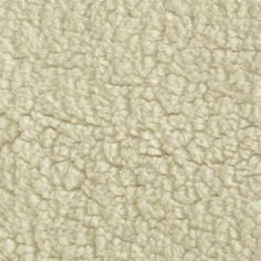 the texture of an upholstered fabric is white and has very light brown tones