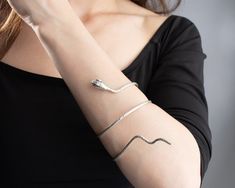 Silver Snake-shaped Bracelet For Parties, Snake-shaped Metal Bracelets As Gifts, Minimalist Adjustable Cuff Bracelet, Silver Minimalist Flexible Jewelry, Adjustable Metal Snake-shape Bracelet, Minimalist Silver Flexible Bracelet, Minimalist Flexible Silver Bracelet, Flexible Adjustable Minimalist Chain Bracelet, Minimalist Cuff Bracelet As Gift