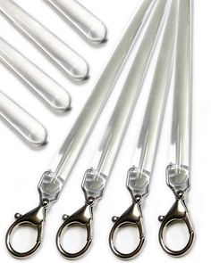 six pairs of scissors are sitting next to each other on a white surface with metal handles