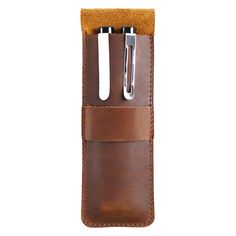 The Paiman Leather Pen Holder is a must-have accessory for any artist or pen enthusiast. Made from 100% full grain genuine leather, this pen holder is not only durable but also exudes a touch of elegance. With dimensions of 6.8 inches by 2.3 inches, this pen holder is perfectly sized to accommodate your favorite fountain pen or pencil. The unique and simple design adds a touch of sophistication to your desk or workspace, making it a perfect gift for yourself or a loved one. The unique and simp Leather Pouch With Card Slots For Formal Occasions, Formal Leather Pouch With Card Slots, Modern Leather Pouch For Gift, Modern Leather Pouch As Gift, Brown Business Pencil Case With Pen Holders, Business Brown Pencil Case With Pen Holders, Modern Leather Pencil Case Gift, Leather Brown Pencil Case With Pen Holders, Brown Leather Pencil Case With Pen Holders