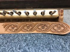 a close up of a wooden instrument with metal fittings on it's sides