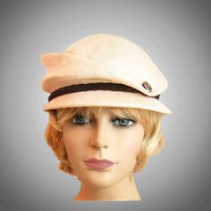 This charming ladies newsboy cap is hand draped on an antique wooden head form.  My hats have an inside adjustable ribbon for fine-tuning the fit,  please indicate your head size measurement when ordering. Comes with a hat box for safe storage. I personally create each hat one at a time, and no two are ever exactly the same.  My hats are 100% handmade using traditional Millinery techniques and the highest quality fabrics and details. Because of this, please allow 2-3 weeks before shipping, unless otherwise agreed upon. Chic Beige Straw Cloche Hat, Vintage Beige Visor Hat, Fitted Beige Brimmed Cloche Hat, Elegant Beige Straw Cloche Hat, Fitted Beige Cloche Straw Hat, Brimmed Beige Straw Cloche Hat, Beige Brimmed Straw Cloche Hat, Elegant Beige Flat Cap, Elegant Beige Straw Hat