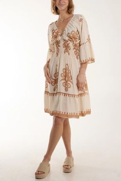 Step into sophistication with our Beige Printed Dress--an epitome of understated elegance. The oversized V-neck silhouette and alluring print make a bold statement. Meticulously crafted, this dress offers a comfortable and chic option for any occasion. The versatile beige hue adds a touch of warmth, making it suitable for both daytime and evening events. Whether paired with heels or flats, this midi dress ensures a stylish and relaxed look, perfect for those seeking a fashion-forward yet comfort