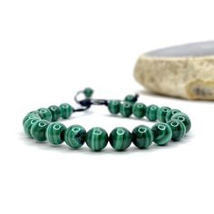 Malachite Beaded Bracelet This item is handmade by Earth's Minerals Inc and is made to order. This listing is for 1 (ONE) Malachite Beaded Bracelet Malachite absorbs negative energies and pollutants, picking them up from the atmosphere and from the body. Guards against radiation and clears electromagnetic pollution. Malachite clears and activates the chakras and attunes to spiritual guidance. It opens the heart to unconditional love. FOLLOW US ON INSTAGRAM @earthsmineralsinc Thank you ! Pictures Adjustable Malachite Spiritual Bracelet, Adjustable Spiritual Malachite Bracelets, Adjustable Spiritual Malachite Bracelet, Adjustable Malachite Beaded Bracelets With Natural Stones, Spiritual Malachite Beaded Bracelets With Gemstone Beads, Handmade Malachite Spiritual Beaded Bracelets, Handmade Malachite Beaded Bracelets For Spiritual Use, Spiritual Malachite Bracelets With 8mm Beads, Adjustable Hand-strung Malachite Bracelets