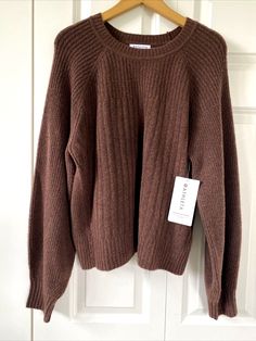 ATHLETA BROWN LAYOVER SWEATER WOMEN'S SIZE 1X NEW WITH TAGS! Soft knit, Merino Wool blend sweater in a rich brown hue, I believe it's alled Mahogany. Tagged a size 1X, it measures 23" across chest at underarms, 24" long from top of shoulder to hem, and 35" from center back neck to end of sleeve.  Description from website: FOR: Layering up to and from your workout FEEL: Soft waffle yarn feels cozy on the skin FAVE: Rib cuffs and collar provide extra comfort #882538 Merino Wool/Nylon/Spandex ALL-A Brown Long Sleeve Sweater For Loungewear, Brown Long Sleeve Loungewear Sweater, Brown Knit Sweatshirt For Winter, Brown Top With Ribbed Cuffs For Fall, Brown Tops With Ribbed Cuffs For Fall, Brown Soft Knit Crew Neck Sweater, Winter Brown Knit Sweatshirt, Brown Relaxed Fit Sweater For Loungewear, Brown Ribbed Crew Neck Sweater