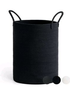 a black basket with handles and two balls