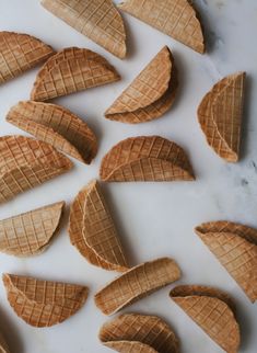 several cones of ice cream on a white surface