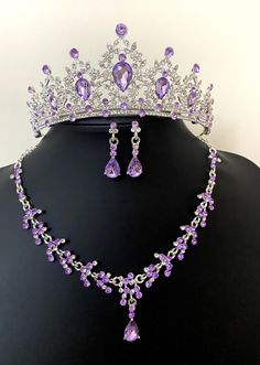 💜 Purple Baroque Bridal Tiara Set - Wedding Quinceanera Crown, Crystal Necklace and Earrings set for brides. Absolutely Stunning Crystal Bridal Necklace and matching earrings set with Purple Tiara!   💜 Luxury Wedding Headpiece encrusted with crystals. This jewelry set is perfect for your special day! Includes a Stunning Tiara, matching necklace, and earrings that are beautifully crafted into a silver setting. Combined with many clear crystal rhinestones!   💜 This beautiful necklace set will dazzle and add an extra elegant look to the bride on your wedding day! A delicate design that will make a statement on your special day such as wedding events/ceremonies.   💜 The design is distinctive and absolutely goes with everything. You will continue to enjoy them after your wedding!   💜 This Purple Flower Jewellery, Purple Prom Jewelry, Purple Tiara, Violet Crown, Fairytale Wedding Decorations, Purple Jewelry Set, Purple Quince, Quinceanera Crown, Wedding Accessories For Bride