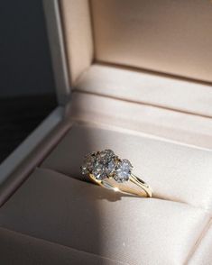 an engagement ring with two diamonds in a box